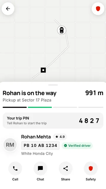 The trip screen showing the driver on the way and a 4-digit trip PIN.